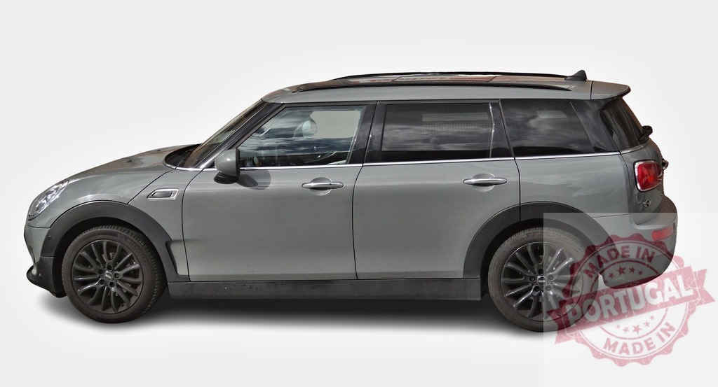 Gray Mini Clubman Cooper S parked on white background, side view | Modern gray Mini Clubman Cooper S with roof rack parked on white background, side view - Realized with Pictrs.com