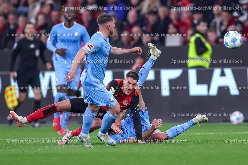 B0428032501039 | 28.03.2025, Fußball, Bayer 04 Leverkusen - VfL Bochum, 1. Fußball Bundesliga, 27. Spieltag, BayArena, Saison 2024 2025: Patrik Schick (Bayer04 Leverkusen #14) stürzt im Zweikampf gegen Ivan Ordets (VfL Bochum #20) DFB regulations prohibit any use of photographs as image sequences and or quasi-video.