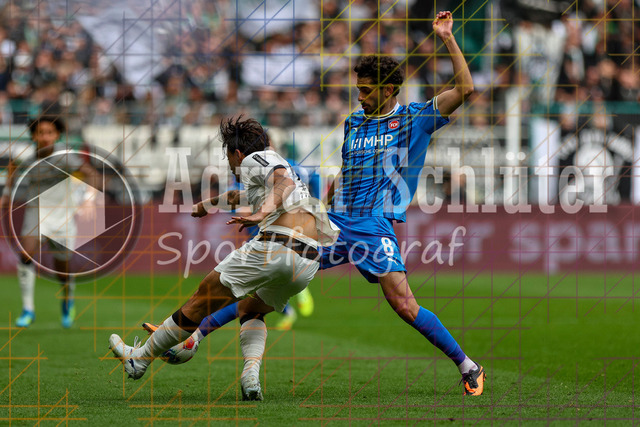 04.04.2026, GER, Fussball, Herren, 1. BL, Saison 2025/2026, Borussia Mönchengladbach - 1. FC Heidenheim | Jens Castrop (Borussia Mönchengladbach) und Eren Sami Dinkci (Heidenheim) im Kampf um den Ball 