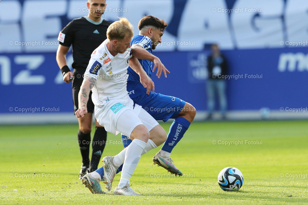A_LUI_300923_11 | SPORT,FUSSBALL,ADMIRAL BUNDESLIGA BLAU WEISS LINZ-AUSTRIA KLAGENFURT 30.09.2023 IM BILD: DANILO MITROVIC (BLAUWEISSLINZ) UND JONAS ARWEILER (KLAGENFURT) FOTO:FOTOLUI