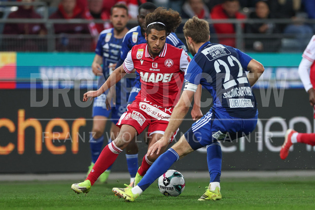 Grazer AK 1902 vs RZ Pellets WAC – Austrian Bundesliga | Graz, Austria, 14.Mar.26 - SOCCER - ADMIRAL Bundesliga, Grazer AK 1902 vs RZ Pellets WAC. The image shows Ramiz Harakate (GAK) and Dominik Baumgartner (WAC).     