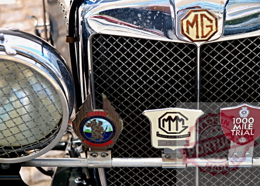 MG radiator grille with badges shining at classic car meeting | Close-up of MG radiator grille with badges, including one for the 1000 Mile Trial, at a classic car meeting - Realisiert mit Pictrs.com