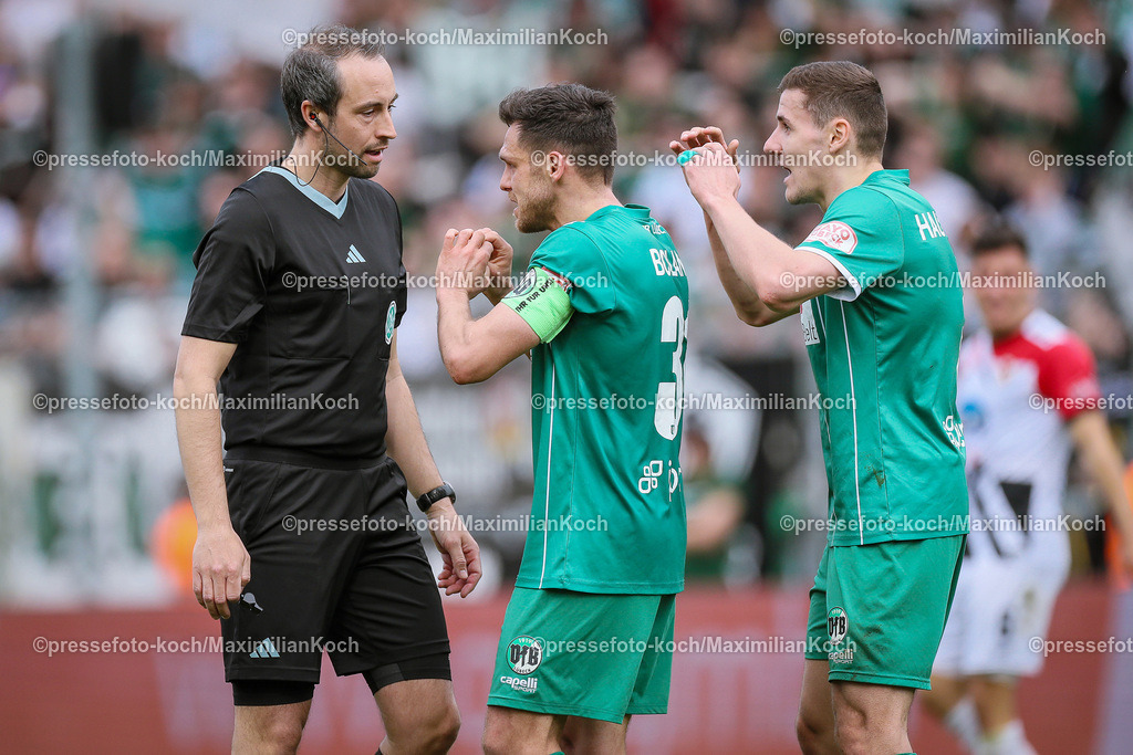 Koe3Liga31032401035 | 31.03.2024, Köln, Fußball, bwin 3. Liga Herren, Sportpark Höhenberg, 31. Spieltag, Saison 2023 2024, FC Viktoria Köln – VfB Lübeck: Marius Hauptmann (VfB Lübeck) und Mirko Boland (VfB Lübeck) diskutieren mit Schiedsrichter Patrick Alt nach der Aktion von Michael Schultz (Viktoria Köln) im Strafraum. 
DFB regulations prohibit any use of photographs as image sequences and or quasi-video.