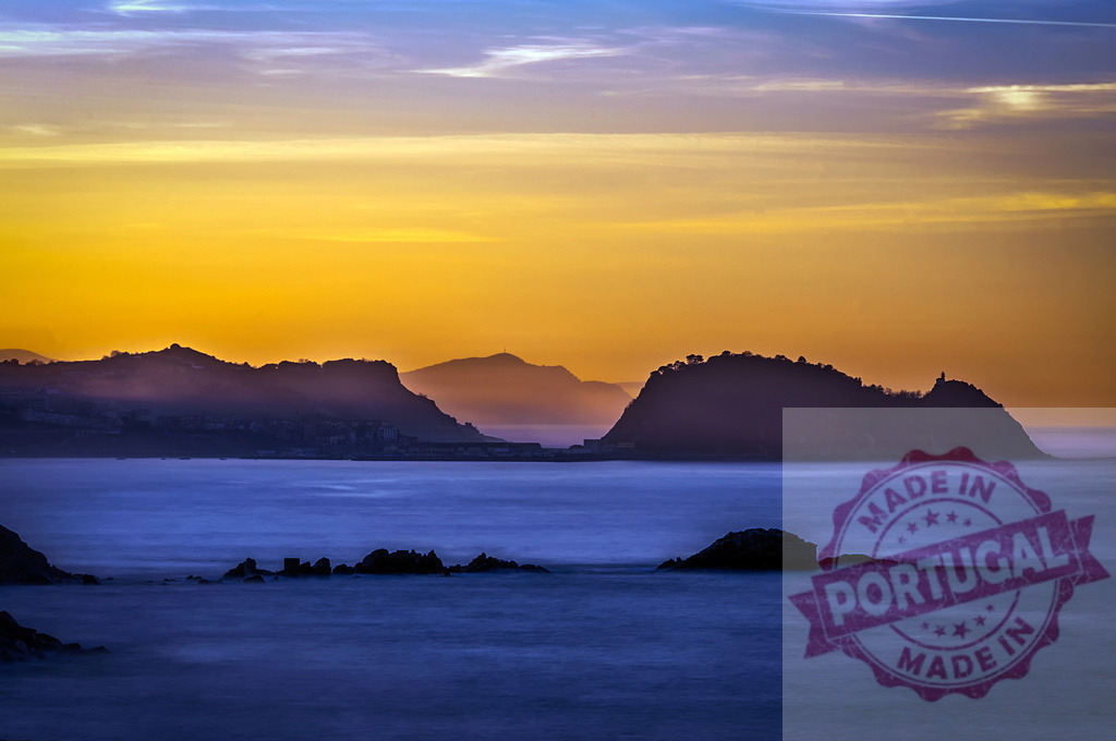 Gaztelugatxe hermitage silhouette during orange sunset over Basque Country coast | Beautiful sunset over San Juan de Gaztelugatxe, with orange sky and calm sea in Basque Country, Spain - Realized with Pictrs.com