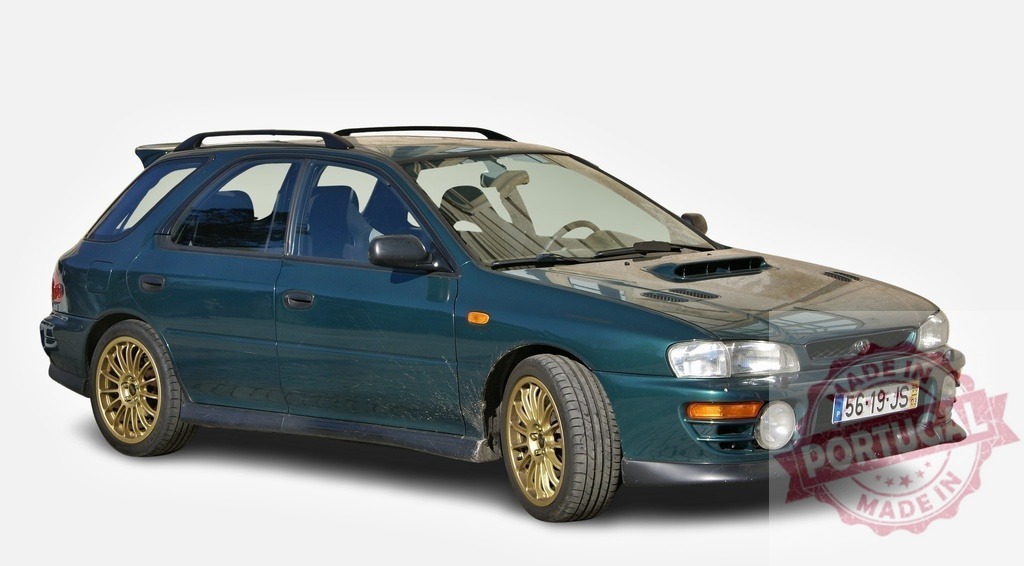 Green Subaru Impreza WRX parked, showing its sporty design and golden rims | Classic Japanese sports car Subaru Impreza WRX parked, highlighting its green paint, golden rims and sporty design - Realized with Pictrs.com