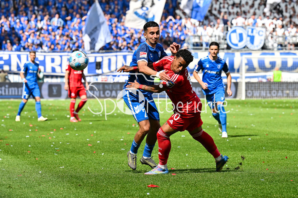 1. FC Magdeburg - Fortuna Düsseldorf | im Duell Livan BURCU (FC Magdeburg 29) und Myron van BREDERODE (Fortuna Duesseldorf 10) / Zweikampf / 2. Bundesliga: 1. FC Magdeburg - Fortuna Duesseldorf, Avnet-Arena am 18.05.2025