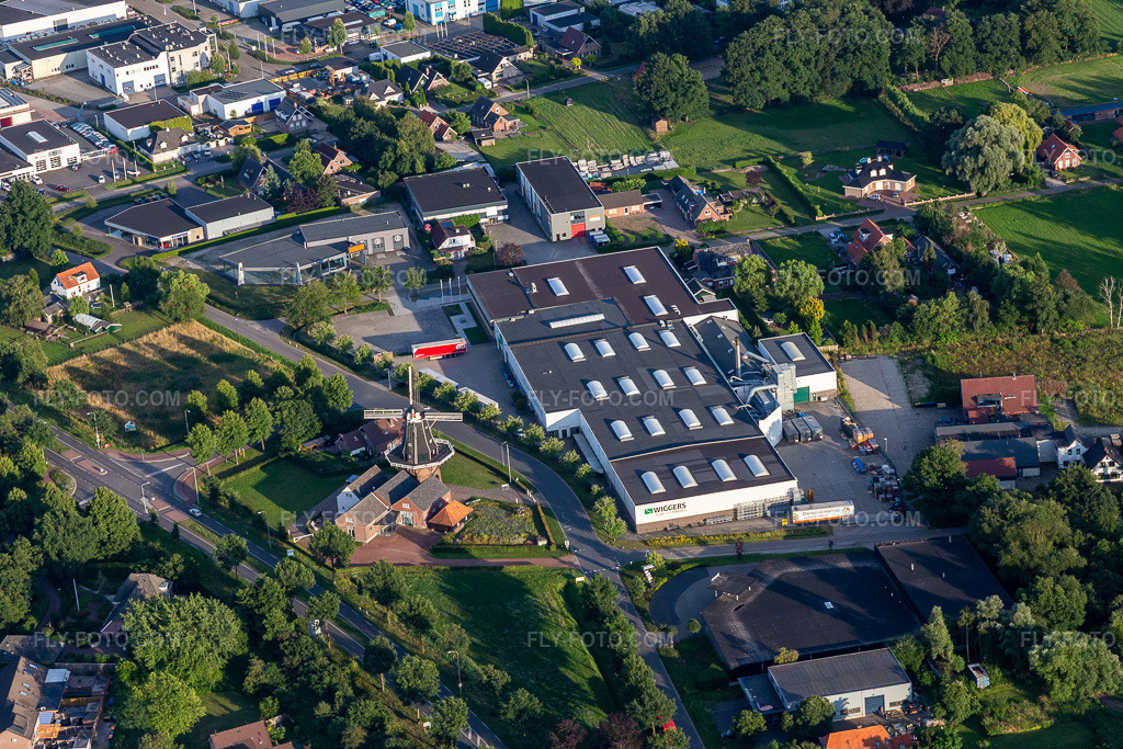 Aerial view: Historic windmill Venemansmolen and Wiggers Lijstsprofielen BV in the district Corle en omgeving in Winterswijk in the state Gelderland, Netherlands.Photo: IMG_007995.jpg taken on 07/12/2020 by Werner Riehm/FLY-FOTO.comResolution of the original: 5472 x 3648 px