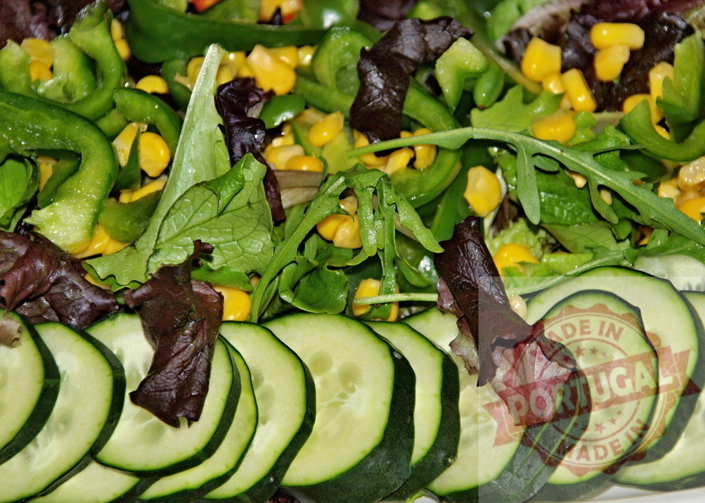 Fresh green garden salad with cucumber slices | Vibrant healthy vegetable salad showing cucumber, lettuce, corn, and bell pepper - Realized with Pictrs.com