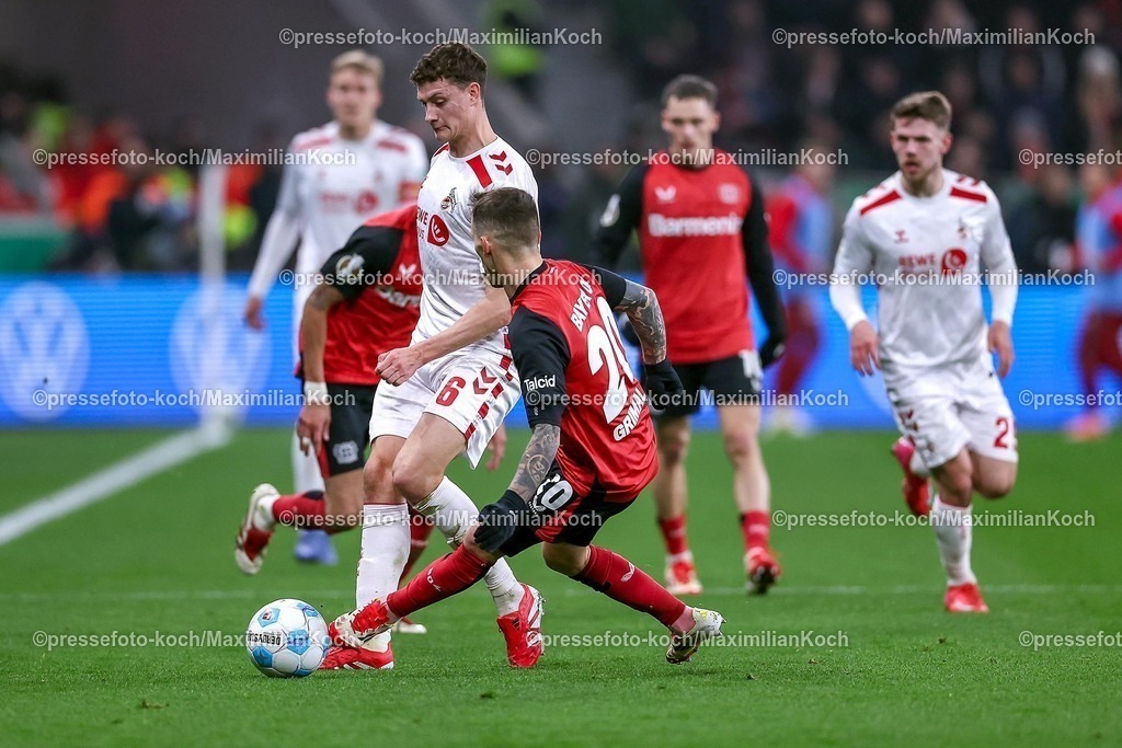 DFB05022502204 | 05.02.2025, Fußball, DFB-Pokal Viertelfinale, Bayer 04 Leverkusen - 1.FC Köln, BayArena, Saison 2024 2025: Eric Martel (FC Köln #6) im Zweikampf gegen Alejandro Grimaldo (Bayer04 Leverkusen #20)DFB regulations prohibit any use of photographs as image sequences and or quasi-video.