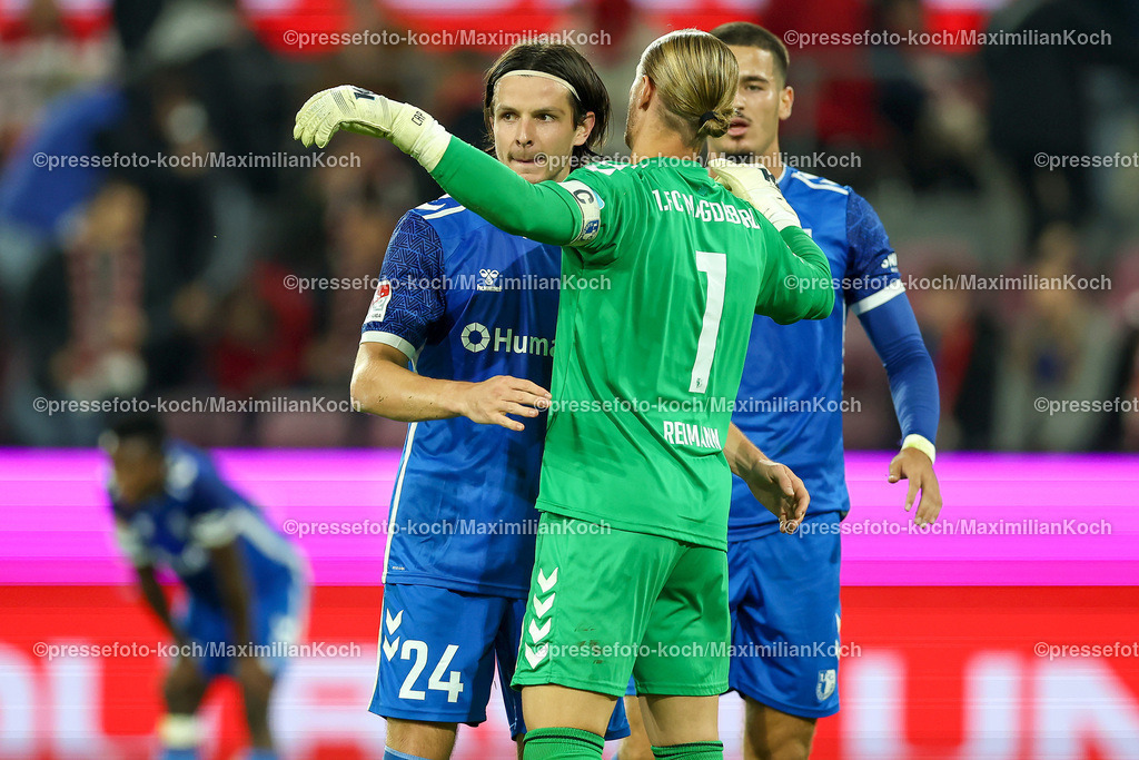 Koe14092402211 | 14.09.2024, 2. Fußball Bundesliga, 1. FC Köln - 1. FC Magdeburg, RheinEnergieSTADION, Saison 2024 2025: Freude nach dem 2:1 Sieg - Jean Hugonet (1.FC Magdeburg #24), Andi Hoti (1.FC Magdeburg #3) und Torwart Dominik Reimann (1.FC Magdeburg #1)DFB regulations prohibit any use of photographs as image sequences and or quasi-video.