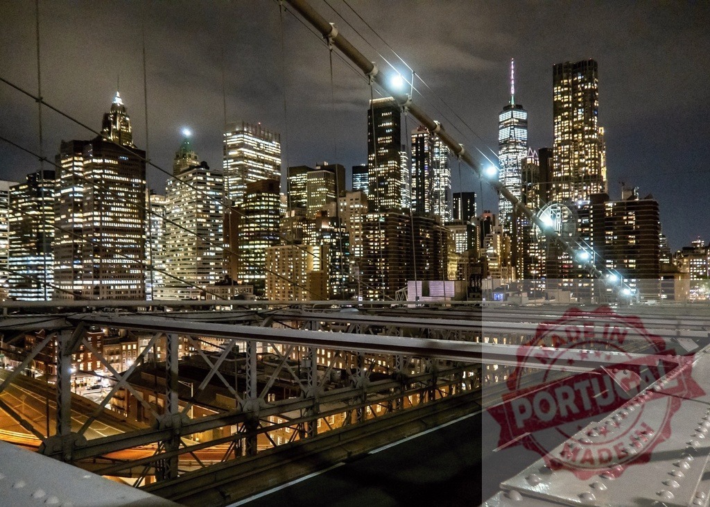 Brooklyn Bridge at night overlooking illuminated Manhattan skyline including One World Trade Center | View from Brooklyn Bridge at night overlooking illuminated Manhattan skyline including One World Trade Center - Realized with Pictrs.com