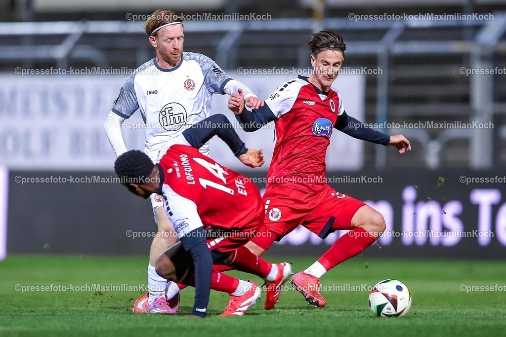 Koe12032501037 | 12.03.2025, Fußball, FC Viktoria Köln – Rot-Weiss Essen, 3.Liga, Sportpark Höhenberg, Saison 2024 2025: Dominik Martinovic (RWE #27) im Zweikampf gegen Jonah Sticker (Viktoria Köln #33) und Enrique Lofolomo (Viktoria Köln #14)DFB regulations prohibit any use of photographs as image sequences and or quasi-video.