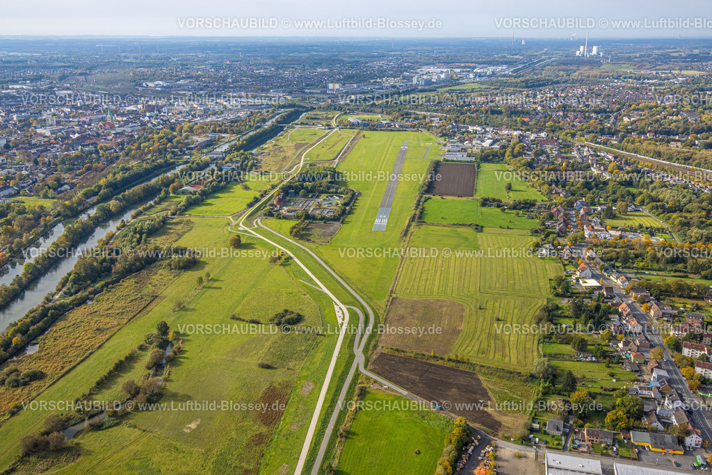 Hamm241015334 | Luftbild, Erlebensraum und Flugplatz Hamm Lippewiesen, Fluss Lippe und Datteln-Hamm-Kanal, Kläranlage Hamm Mattenbecke, City Innenstadtansicht und rechts Wohngebiet Ortsteil Heessen, Blick zu  Kraftwerk Bergkamen, Trianel Kohlekraftwerk Lünen und RWE Generation SE Kraftwerk Gersteinwerk, Stadtbezirk Heessen, Hamm, Ruhrgebiet, Nordrhein-Westfalen, Deutschland