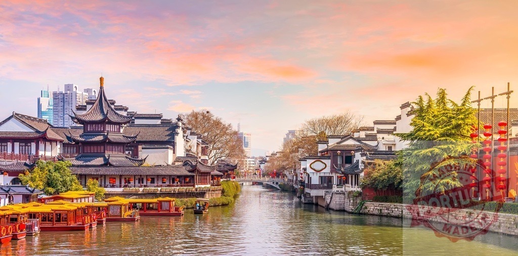 Nanjing Qinhuai River historic district at sunset | Traditional Chinese architecture lining Qinhuai River with illuminated lanterns at sunset - Realized with Pictrs.com