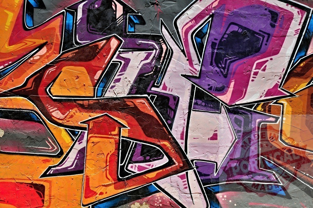 Colorful graffiti art exploding with vibrant energy on urban wall | Dynamic graffiti artwork bursting with color and intricate details on a textured wall, showcasing urban art and street culture - Realized with Pictrs.com