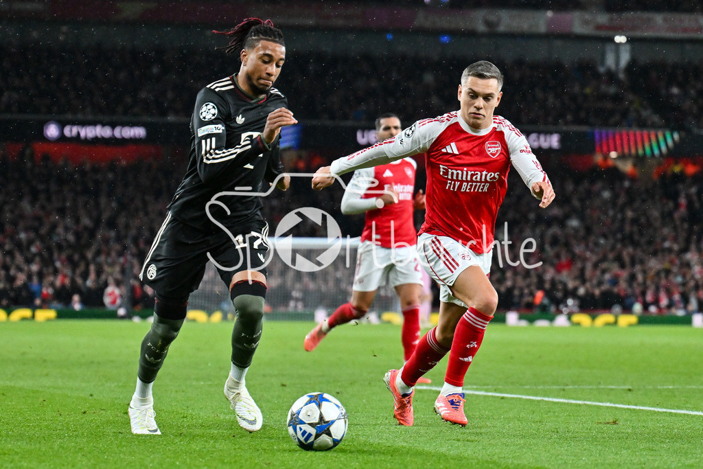 Arsenal FC - FC Bayern München | LONDON, ENGLAND - 26. NOVEMBER: im Duell Michael OLISE (FC Bayern Munich 17) und Leandro TROSSARD (Arsenal FC 19) beim Ligaspiel zwischen Arsenal London und dem FC Bayern München am 5. Spieltag der UEFA Champions League im Emirates Stadium am 26.11.2025