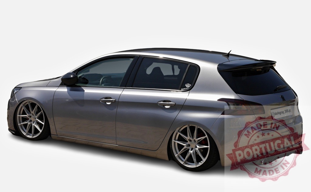 Silver Peugeot 308 showcasing aftermarket parts and lowered suspension | Customized Peugeot 308 displaying tuning modifications in a studio setting - Realisiert mit Pictrs.com