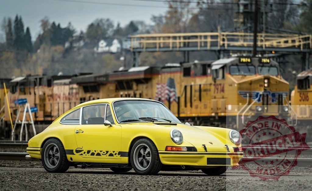 Yellow Porsche 911 parked near Union Pacific train | Classic yellow Porsche 911 parked near a Union Pacific train - Realized with Pictrs.com