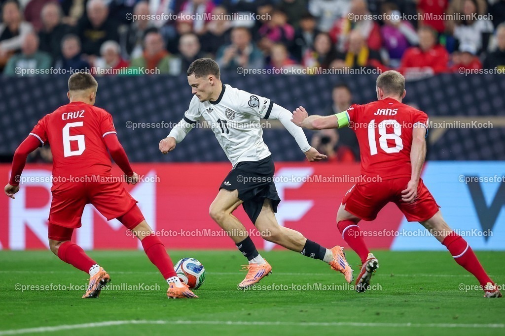 DFB10102502203 | 10.10.2025, Fußball, Länderspiel, Deutschland - Luxemburg, UEFA WM-Qualifikation, 2025/2026, Gruppe A, PreZero Arena in Sinsheim: Florian Wirtz (GER #17) im Zweikampf gegen  Tomas Moreira (LUX #06) und Laurent Jans (LUX #18) DFB regulations prohibit any use of photographs as image sequences and or quasi-video.