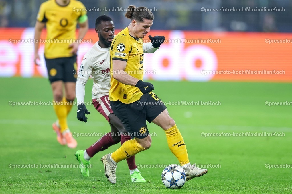 UCL25112501050 | 25.11.2025, Fußball, UEFA Champions League, Borussia Dortmund - FC Villarreal, BVB Stadion, 5. Spieltag, Saison 2025 2026: Nicolas Pepe&nbsp;(FC Villarreal #19) im Zweikampf gegen  Marcel Sabitzer&nbsp;(BVB #20)  Regulations prohibit any use of photographs as image sequences and or quasi-video.