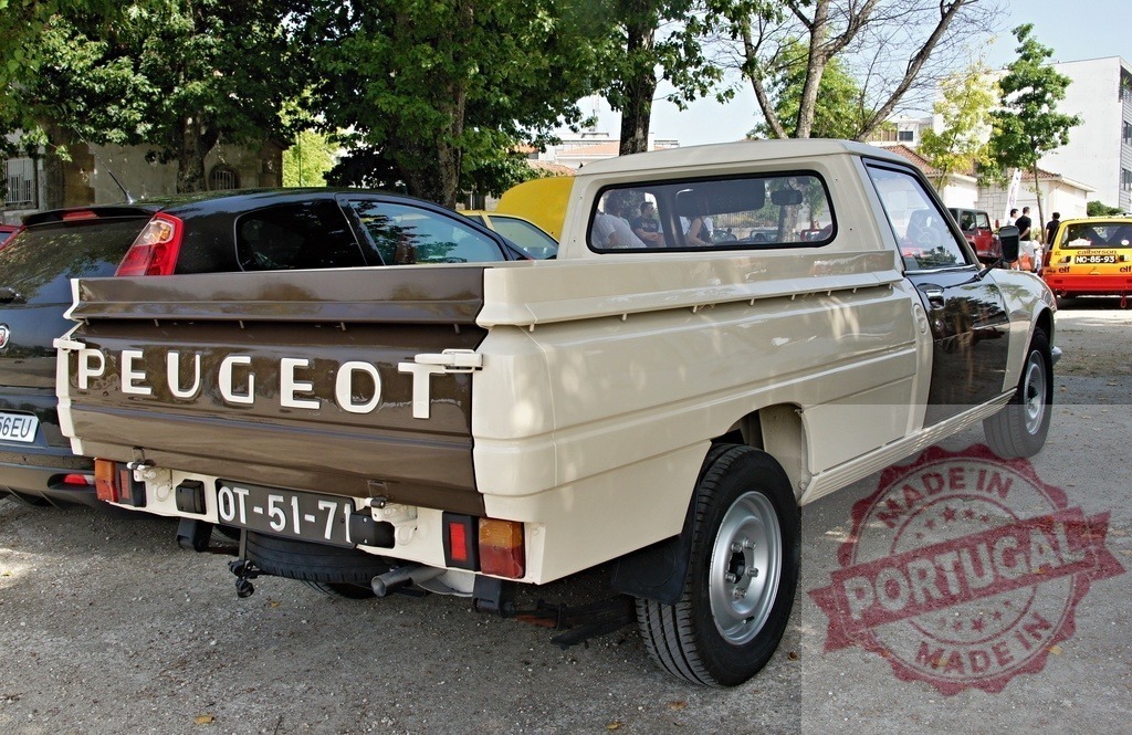 Vintage Peugeot pickup truck parked in a parking lot | Brown and beige vintage Peugeot pickup truck parked in a parking lot - Realized with Pictrs.com