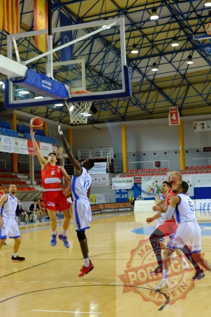 Basketball player making layup shot during game | Basketball players competing for the ball during an intense professional game on court - Realized with Pictrs.com