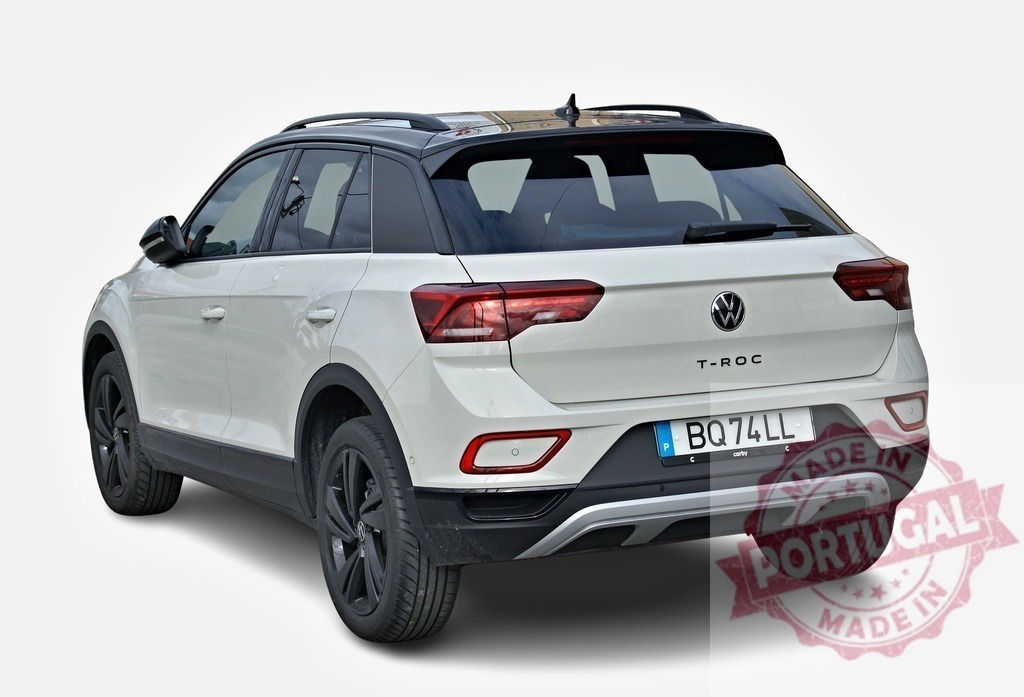 White Volkswagen T-Roc crossover parked on white background, rear view | Modern white Volkswagen T-Roc crossover showcasing its rear design, parked on a seamless white backdrop - Realized with Pictrs.com