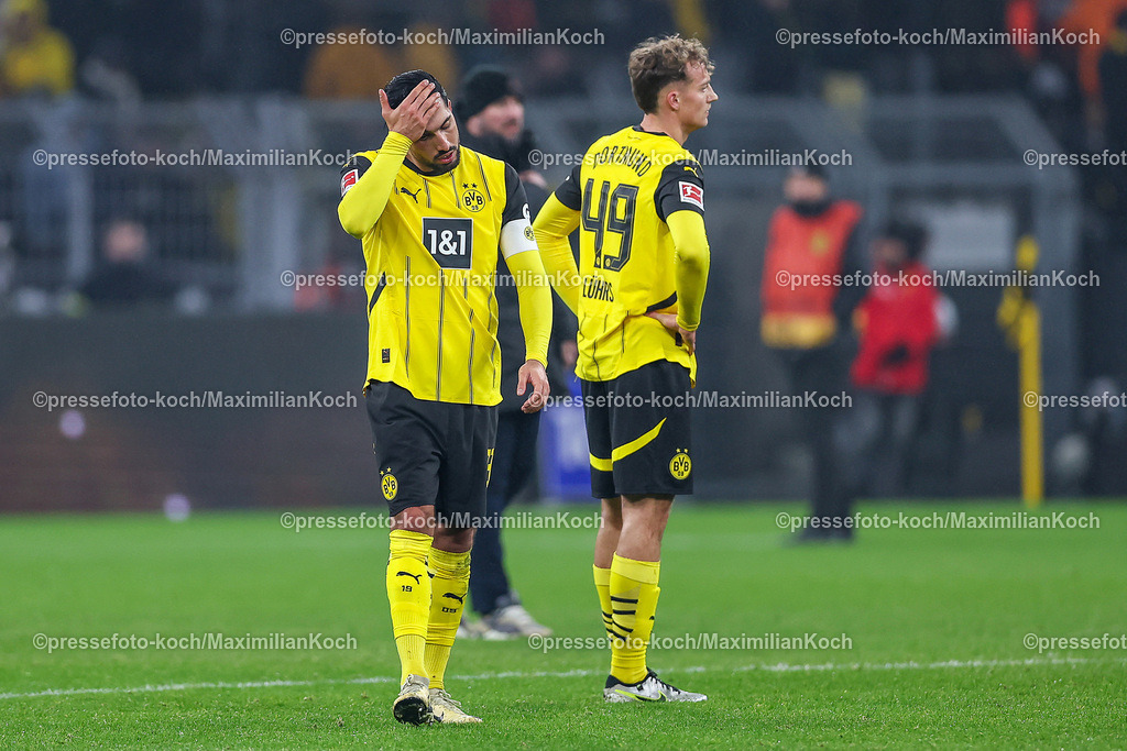 BVB15122401099 | 15.12.2024, Fußball, Borussia Dortmund - TSG 1899 Hoffenheim, 1. Fußball Bundesliga, 14. Spieltag, Signal Iduna Park, Saison 2024 2025: Enttäuschung - Enttäuschte Gesichter nach dem 1:1 Ausgleich Endstand beim BVB - Emre Can (BVB #23) neben Yannik Luka Lührs (BVB #49)DFB regulations prohibit any use of photographs as image sequences and or quasi-video.