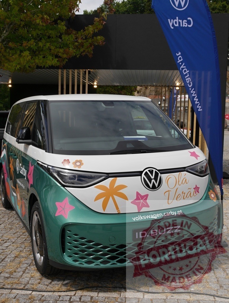 Volkswagen ID. Buzz electric van promoting summer travel | Volkswagen ID. Buzz electric van parked outdoors, decorated with summer tropical stickers - Realized with Pictrs.com