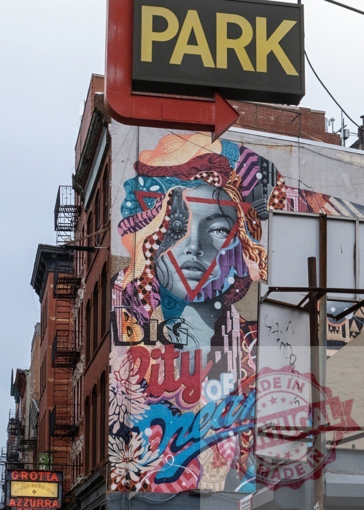 Big city of dreams mural decorating building facade in Nolita, Manhattan, New York City | Colorful street art mural covering entire building facade, showcasing woman face and big city of dreams inscription, in Nolita, Manhattan, New York - Realisiert mit Pictrs.com
