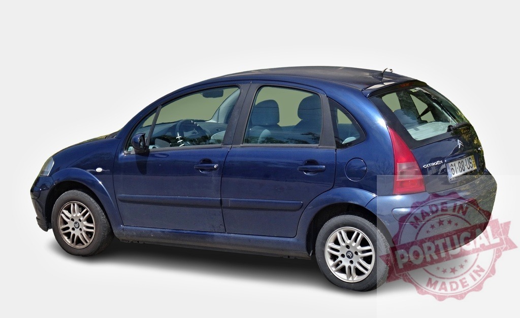 Dark blue Citroën C3 showing its right side, parked on a white background | Studio shot of a dark blue Citroën C3 from the first generation, parked and slightly facing left - Realized with Pictrs.com