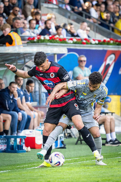 German 3rd Division, Viktoria Koeln vs. Alemannia Aachen, 10.05.2026 | KOELN, GERMANY - MAY 10, 2026: Taylan Duman (Viktoria Köln, 4) is challenged by Mehdi Loune (Alemannia Aachen, 11) during the 3rd division match on gameday 37 between Viktoria Koeln vs. Alemannia Aachen at the Sportpark Hoehenberg on May 10, 2026 in Koeln, Germany. DFL REGULATIONS PROHIBIT ANY USE OF PHOTOGRAPHS AS IMAGE SEQUENCES AND/OR QUASI-VIDEO.