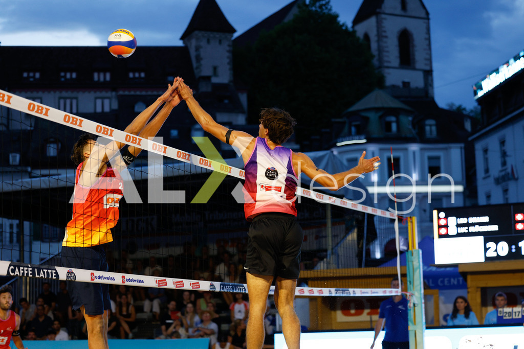 Obi BeachTour 2026 - Basel | BASEL, SWITZERLAND - JULY 17: DANIEL ALLEMANN (SUI) attack / spike against LUC EMANUEL FLÜCKIGER (SUI) block during the Obi BeachTour 2026 match between DILLIER / FLÜCKIGER (SUI) and ALLEMANN / LEFFLER (SUI) at Barfüsserplatz on July 17, 2026 in Basel, Switzerland. - Realisiert mit Pictrs.com