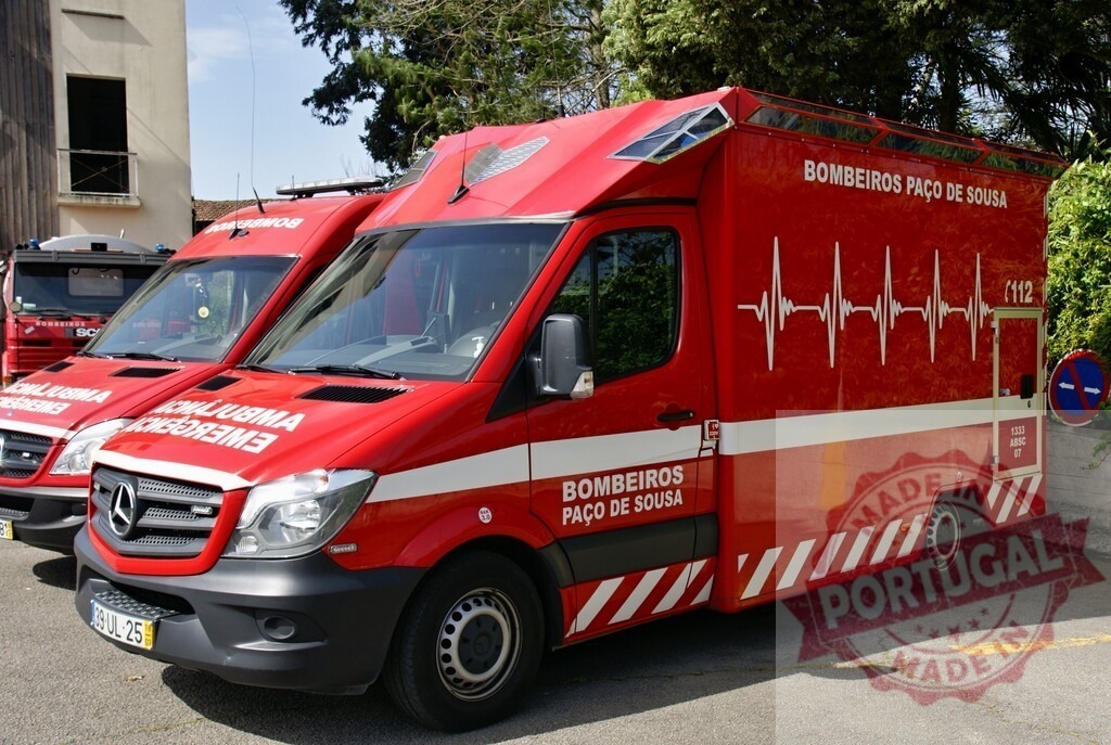 Bombeiros Paço de Sousa ambulance parked outdoors, ready for emergencies | Red Mercedes-Benz ambulance from Bombeiros Paço de Sousa on standby for emergency services - Realisiert mit Pictrs.com