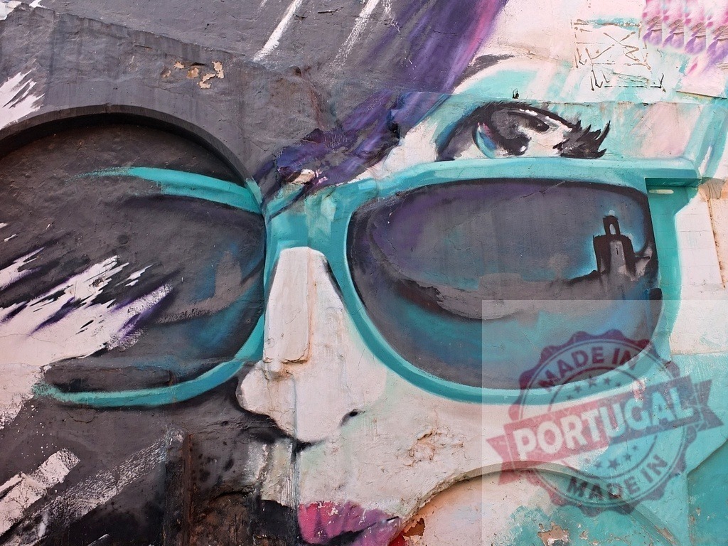 Urban graffiti art featuring woman wearing sunglasses | Urban wall mural depicting a stylized woman with a building reflecting in her sunglasses - Realized with Pictrs.com