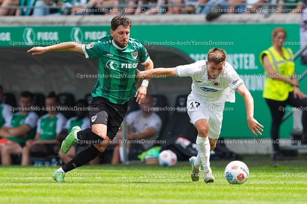 xYDR26072501010 | 26.07.2025, xydrx, Fußball, SC Preußen Münster - Viktoria Köln, Testspiel, LVM-Preußenstadion: Haralambos Makridis (SC Preußen Münster #14) im Zweikampf gegen Marco Pledl (Viktoria Köln #17)
