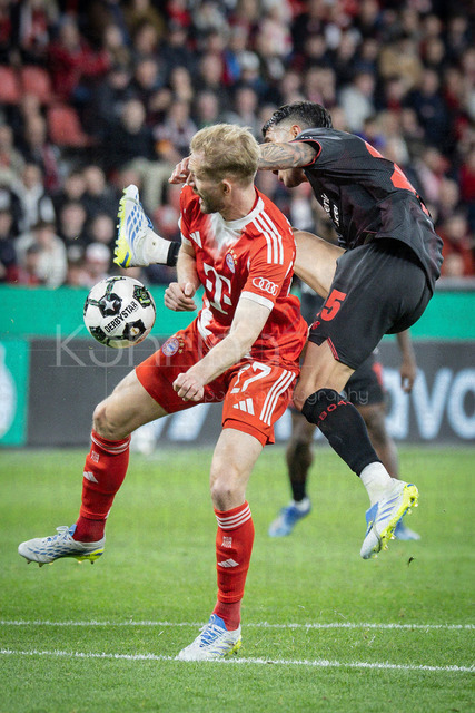 DFB Cup semifinal match Bayer 04 Leverkusen vs. FC Bayern Munich, 22.04.2026 | LEVERKUSEN, GERMANY - APRIL 22, 2026: Konrad Laimer (FC Bayern Muenchen, 27) and Exequiel Palacios (Bayer 04 Leverkusen, 25) tackling during the German DFB Cup semifinal match between Bayer 04 Leverkusen vs. FC Bayern Munich at BayArena on April 22, 2026 in Leverkusen, Germany. DFL REGULATIONS PROHIBIT ANY USE OF PHOTOGRAPHS AS IMAGE SEQUENCES AND/OR QUASI-VIDEO.