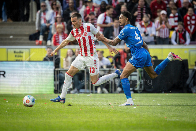 German Bundesliga,  1. FC Koeln - Bayer 04 Leverkusen, 25.04.2026 | KOELN, GERMANY - APRIL 25, 2026 :  Jarell Quansah (Bayer 04 Leverkusen, 4) holds Said El Mala  (1. FC Koeln, 13) during the German Bundesliga match on gameday 31 between 1. FC Koeln - Bayer 04 Leverkusen at RheinEnergieSTADION on April 25, 2026 in Koeln, Germany. DFL REGULATIONS PROHIBIT ANY USE OF PHOTOGRAPHS AS IMAGE SEQUENCES AND/OR QUASI-VIDEO.