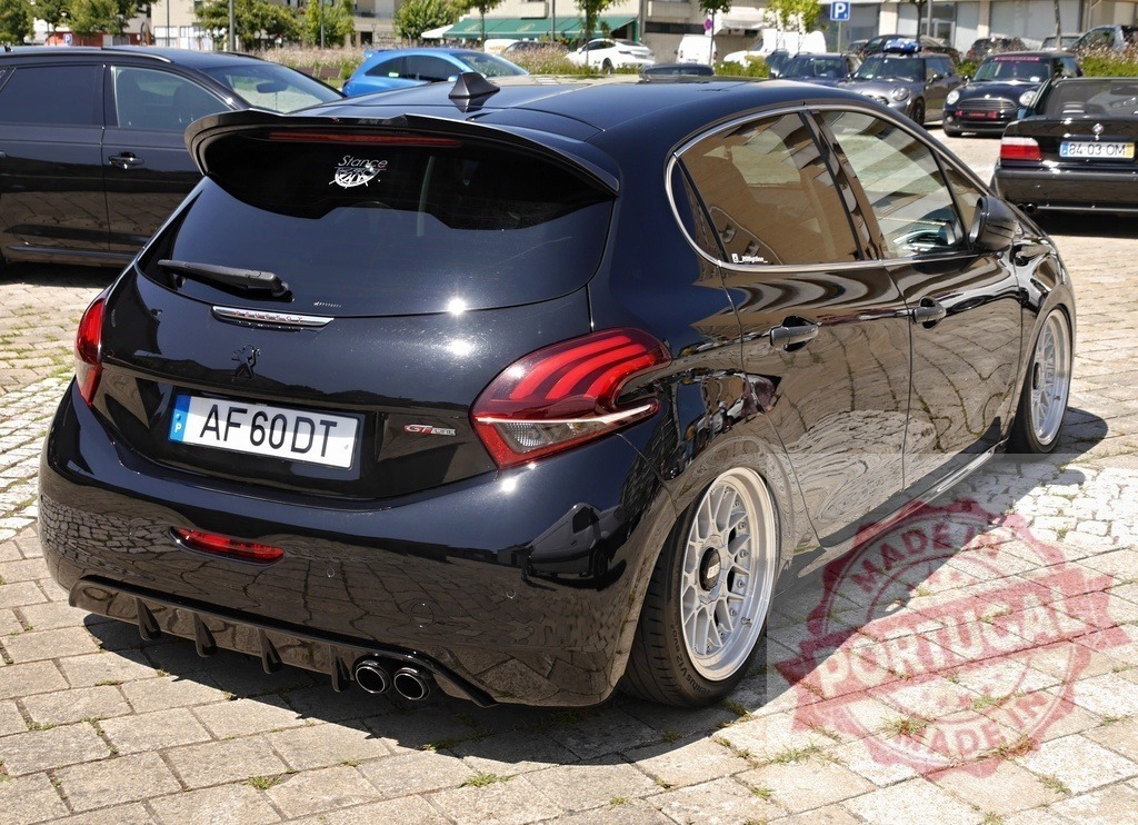Black Peugeot 208 GT car with custom rims | Black Peugeot 208 GT car featuring a lowered chassis and custom BBS wheels parked on cobblestones - Realized with Pictrs.com