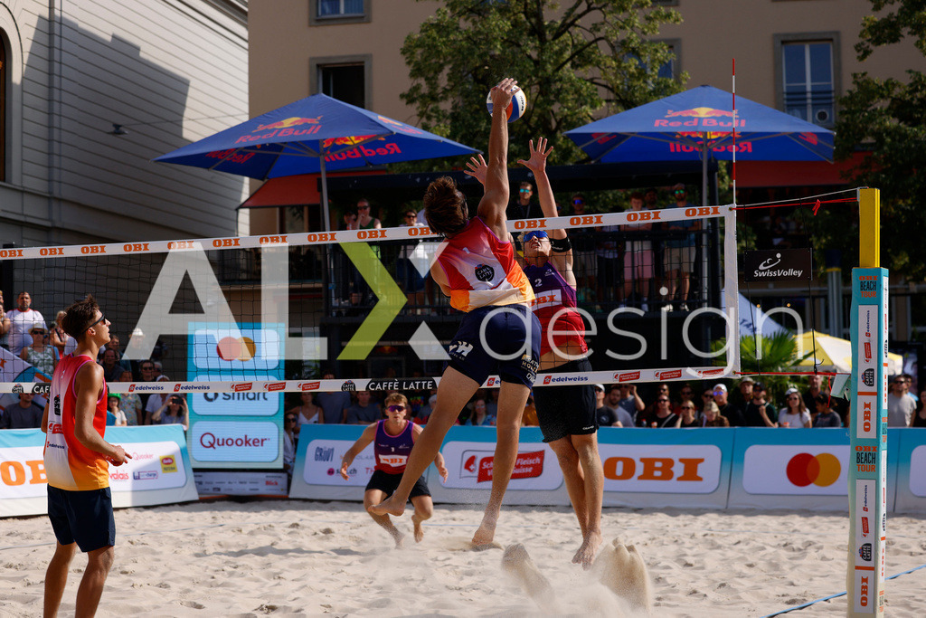 Obi BeachTour 2026 - Basel | BASEL, SWITZERLAND - JULY 19: LEO DILLIER (SUI) attack / spike against MATHIS KÄLIN (SUI) block during the Obi BeachTour 2026 match between DILLIER / FLÜCKIGER (SUI) and BREER / KÄLIN (SUI) at Barfüsserplatz on July 19, 2026 in Basel, Switzerland. - Realisiert mit Pictrs.com