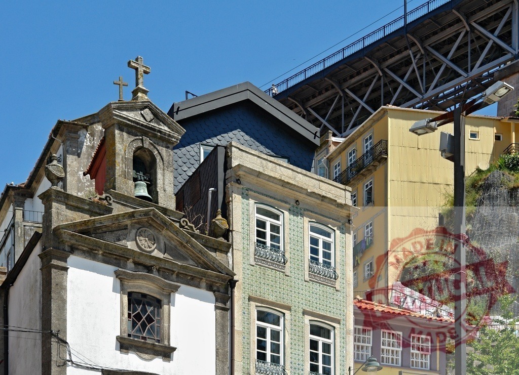 Porto historic architecture with Dom Luís I Bridge | Beautiful old buildings and a church with a bell tower under the Dom Luís I Bridge - Realized with Pictrs.com