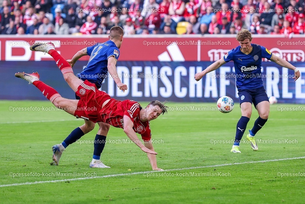 F9510042601033 | 10.04.2026, Fußball, Fortuna Düsseldorf - Holstein Kiel, 2. Fußball Bundesliga, Herren, Merkur Spiel-Arena, 29. Spieltag, Saison 2025 2026: Strafraumaktion Cedric Itten&nbsp;(Fortuna Düsseldorf #13) im Zweikampf gegen  Ivan Nekic&nbsp; (Holstein Kiel #13)  DFB regulations prohibit any use of photographs as image sequences and or quasi-video.