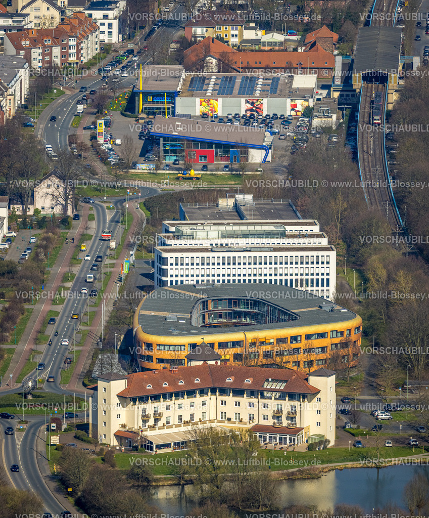 Duisburg240303077 | Luftbild, Gewerbegebiet mit Hotel Landhaus Milser, VBG-Bezirksverwaltung Duisburg, Xella International GmbH und Edeka E-Center Angerbogen, überdachter Bahnhof Angerbogen, Huckingen, Duisburg, Ruhrgebiet, Nordrhein-Westfalen, Deutschland, Duisburg-S