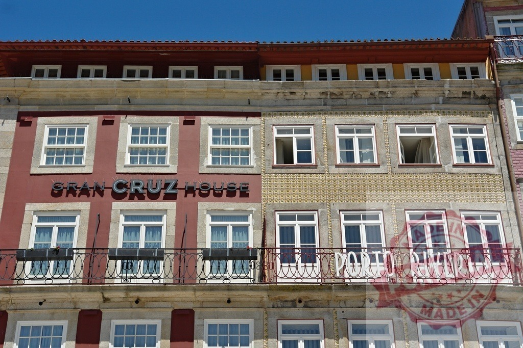 Gran Cruz House and Porto River hotel facades in Porto | Building facades of two hotels, Gran Cruz House and Porto River, featuring windows and balconies - Realized with Pictrs.com