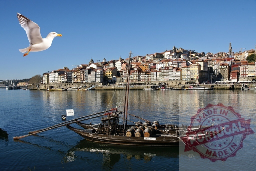 Porto city view with rabelo boat and flying seagull | Douro river Rabelo boat carrying port wine barrels, with Ribeira architecture and a seagull in flight - Realized with Pictrs.com