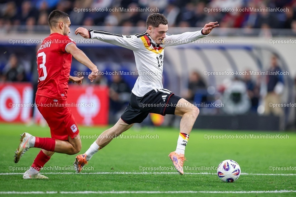 DFB14112501063 | 14.11.2025, Fußball, Länderspiel, WM-Qualifikation Europa, Deutschland - Luxemburg, Stade de Luxembourg (Croix de Gasperich, Luxemburg), 9. Spieltag, Saison 2025 2026: Florian Wirtz (GER #17) im Zweikampf gegen  Dirk Carlson (LUX #13)  Regulations prohibit any use of photographs as image sequences and or quasi-video.