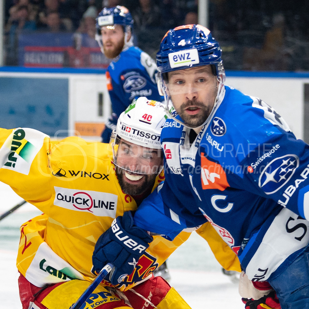 Playoffs: ZSC Lions - EHC Biel-Bienne | 04.04.2022, Zurich, Hallenstadion, Playoffs: ZSC Lions - EHC Biel-Bienne, #40 Etienne Froidevaux (Biel) läuft bei #4 Patrick Geering (ZSC) auf. - Realisiert mit Pictrs.com