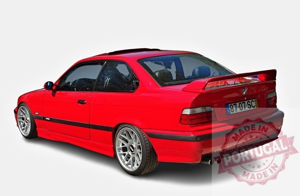 Red BMW M3 E36 parking outdoor with alloy wheels | Customized red BMW M3 E36 parking outdoor, featuring alloy wheels, sunroof and a distinctive rear spoiler - Realisiert mit Pictrs.com