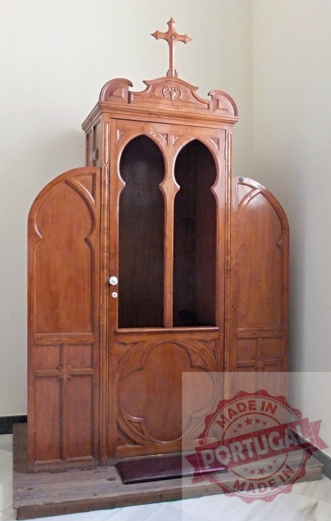 Old wooden confessional booth in a Catholic church | Wooden confessional booth standing in a Catholic church corner, ready for sacrament - Realized with Pictrs.com