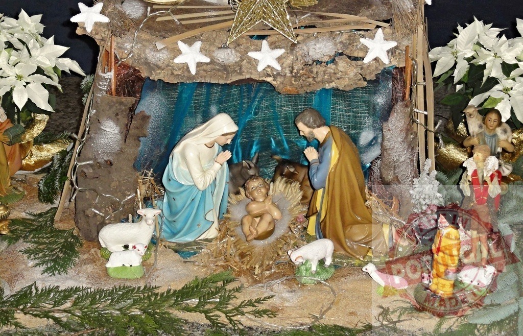 Nativity scene with baby Jesus, Mary and Joseph praying in the stable | Christmas nativity scene representing the birth of Jesus, with Mary and Joseph praying, surrounded by shepherds and animals - Realized with Pictrs.com